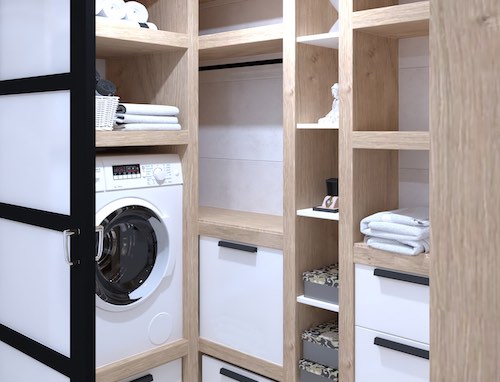 Dressing aux étagères en bois clair avec un lave-linge