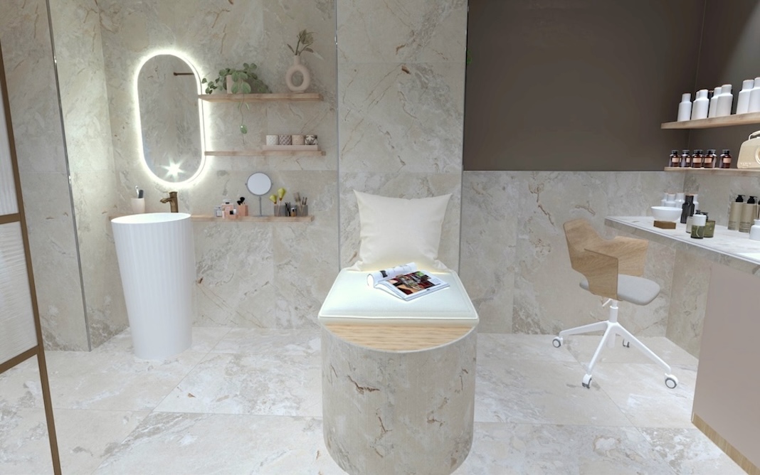 Un lavabo totem blanc et le plan de travail de l'atelier de cosmétiques sont séparés par une banquette maçonnée.